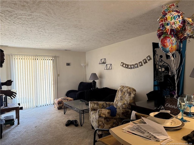 living room with carpet floors and a textured ceiling