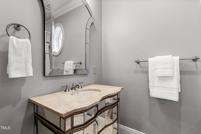 bathroom featuring baseboards and vanity