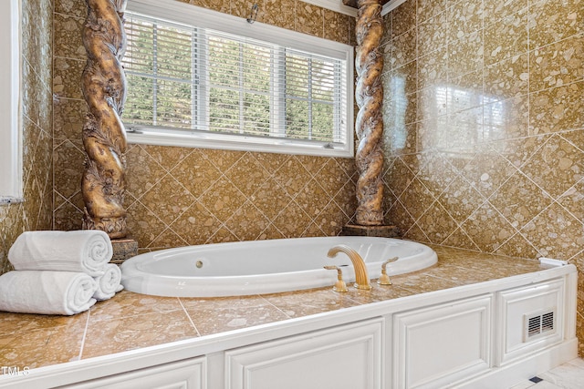 full bathroom featuring visible vents and a garden tub