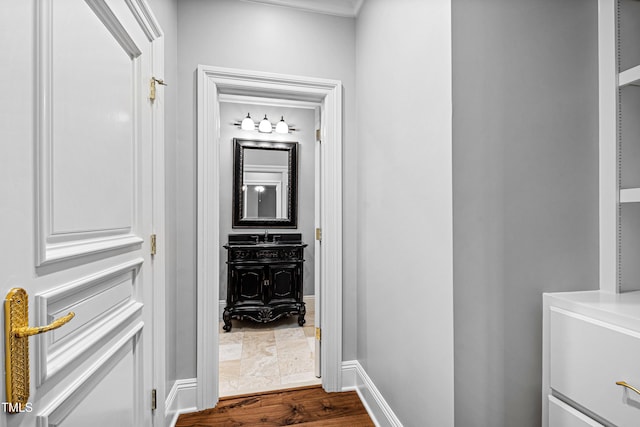 hall with baseboards and dark wood finished floors