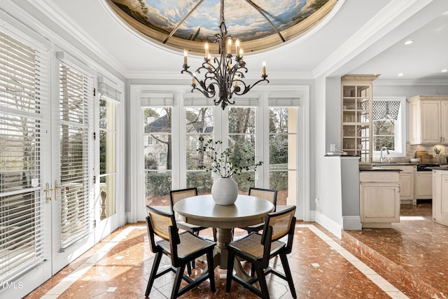 dining space with a tray ceiling, french doors, baseboards, and a wealth of natural light