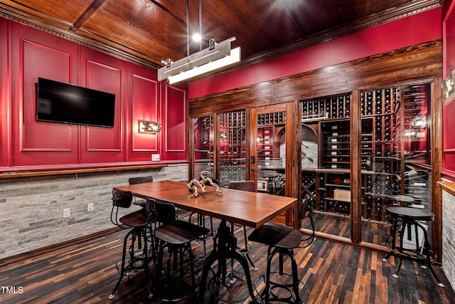 wine area with wood ceiling and dark wood-style flooring