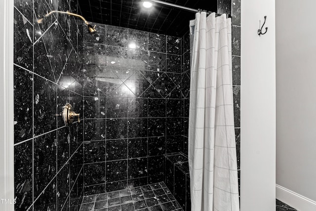 full bath featuring tiled shower