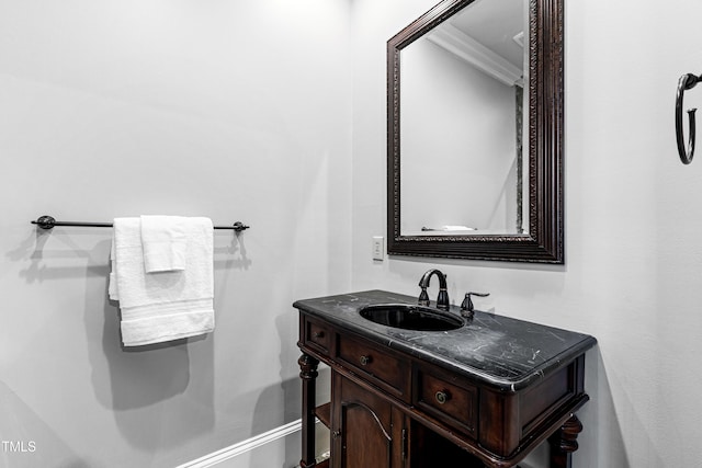 bathroom with vanity and crown molding