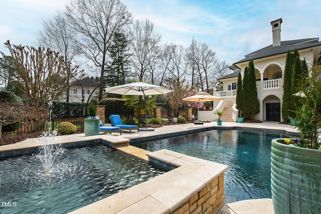 view of pool with a fenced in pool, a patio, and fence