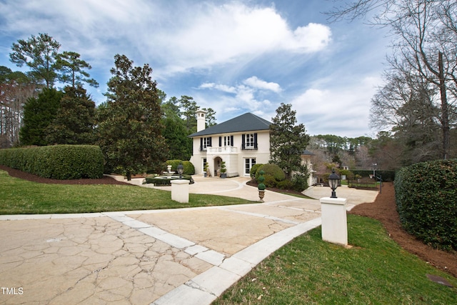 view of community featuring a yard and a patio