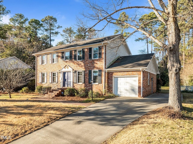 colonial-style house featuring a garage