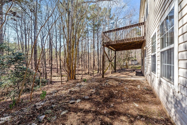 view of yard with a wooden deck