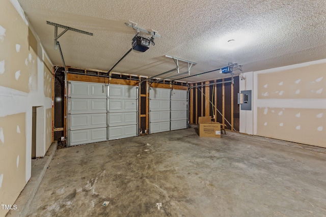 garage featuring electric panel and a garage door opener