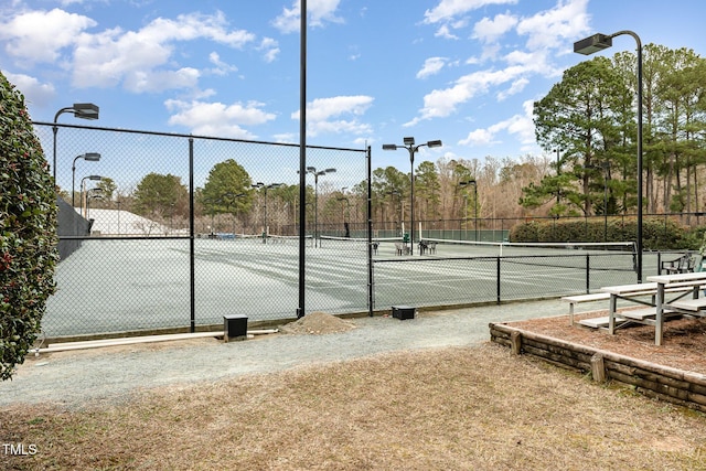 view of sport court with fence