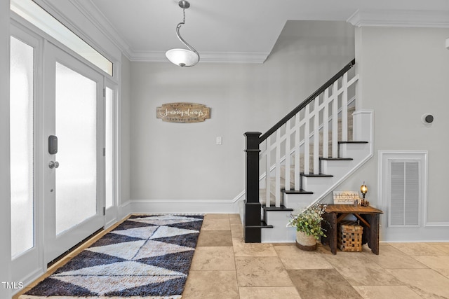 foyer featuring stairway, baseboards, visible vents, and ornamental molding