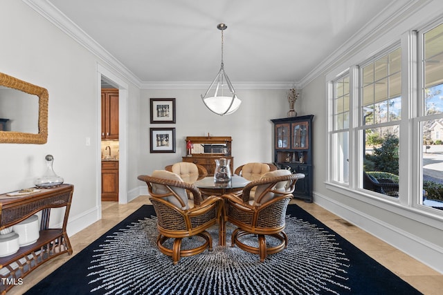 dining area with ornamental molding, visible vents, and baseboards