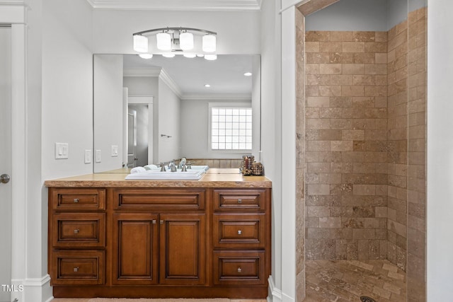 bathroom with a walk in shower, ornamental molding, and vanity