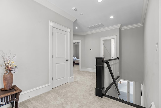 hallway featuring recessed lighting, light colored carpet, an upstairs landing, baseboards, and crown molding