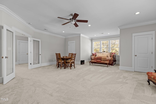 sitting room featuring recessed lighting, baseboards, crown molding, and light colored carpet