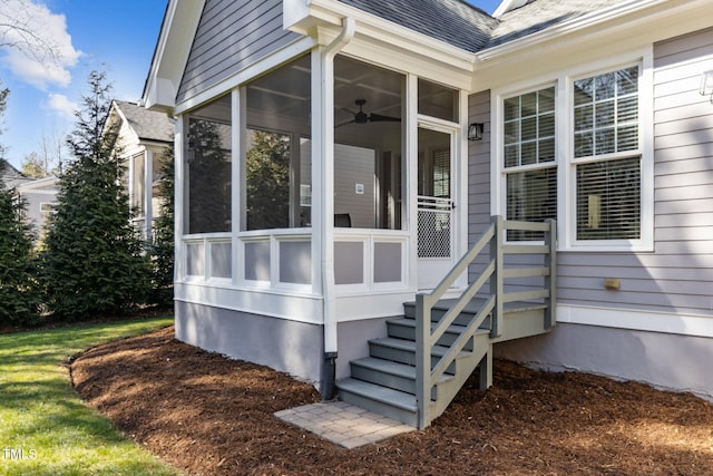 doorway to property featuring roof with shingles