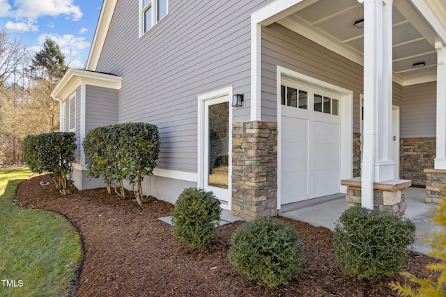 view of property exterior featuring stone siding and covered porch