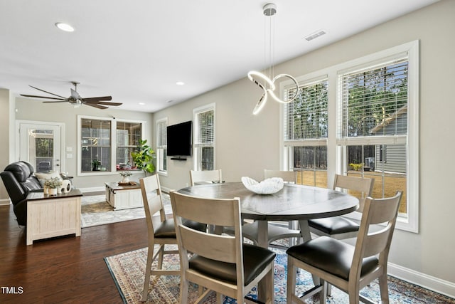 dining room featuring baseboards, visible vents, dark wood-style flooring, and recessed lighting