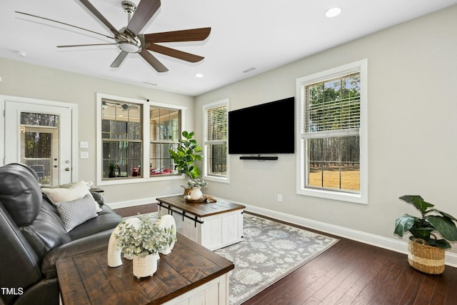 living area featuring a ceiling fan, recessed lighting, wood-type flooring, and baseboards