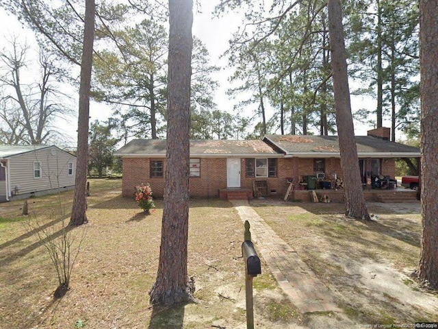 single story home with brick siding, crawl space, and a chimney