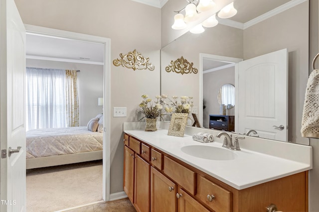 ensuite bathroom with an inviting chandelier, ornamental molding, connected bathroom, vanity, and baseboards