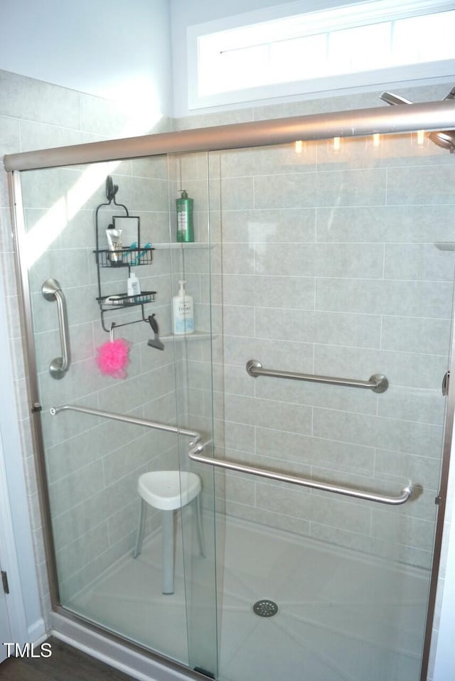 full bathroom featuring a stall shower