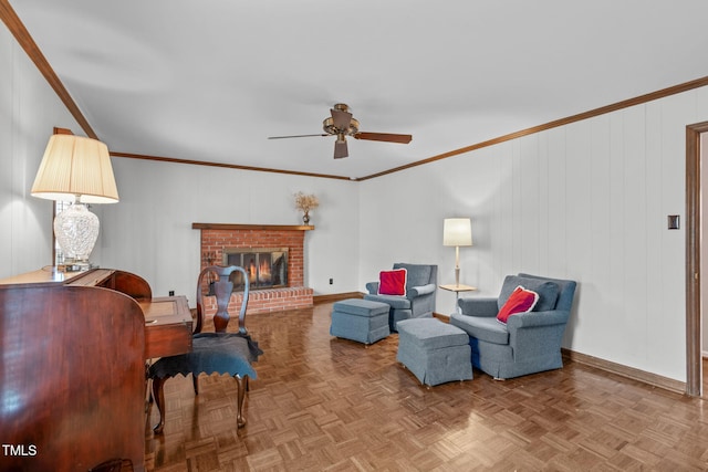 living area with baseboards, a fireplace, and ornamental molding