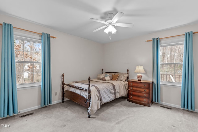 bedroom with carpet, visible vents, and baseboards