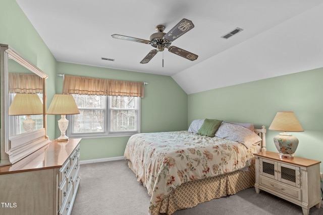 carpeted bedroom featuring lofted ceiling, visible vents, ceiling fan, and baseboards