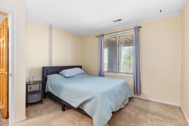 bedroom featuring ornamental molding and light colored carpet