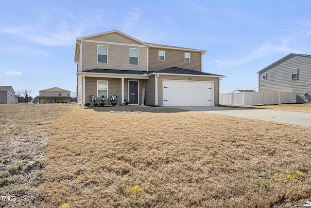 view of front of property with concrete driveway, covered porch, an attached garage, fence, and a front lawn