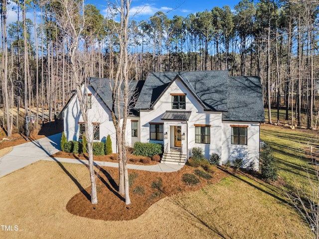 view of front of house with a front lawn