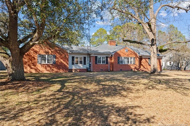 ranch-style house featuring a front lawn