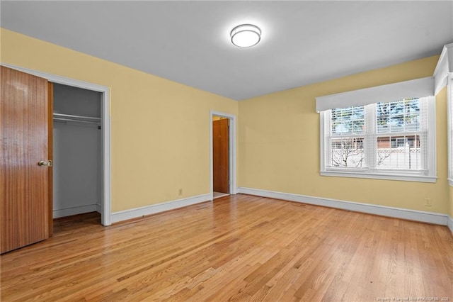 unfurnished bedroom with light wood-type flooring