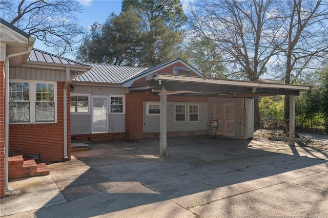 exterior space with a carport