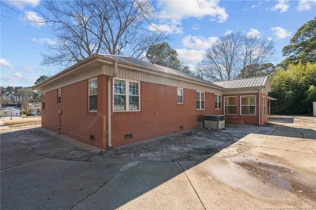 view of property exterior with a patio