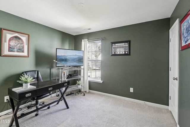 office featuring light colored carpet, visible vents, and baseboards