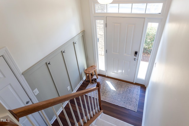 foyer with stairs and wood finished floors