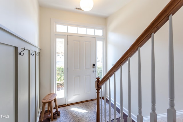 entryway featuring visible vents and stairway