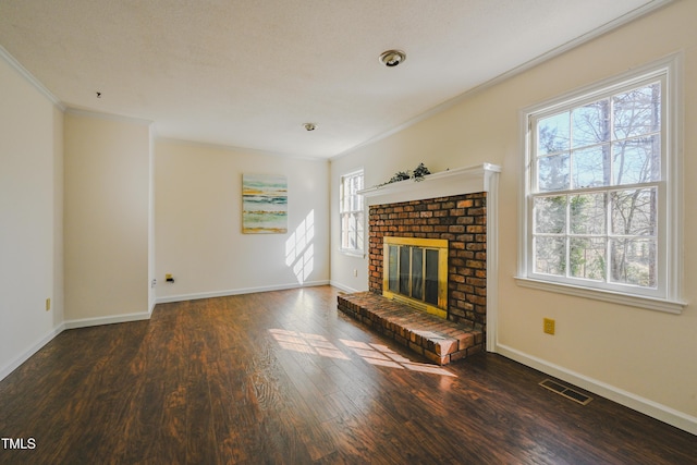 unfurnished living room featuring dark wood-style flooring, visible vents, a fireplace, and baseboards