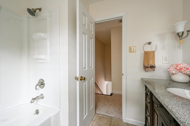 bathroom with  shower combination, baseboards, and vanity