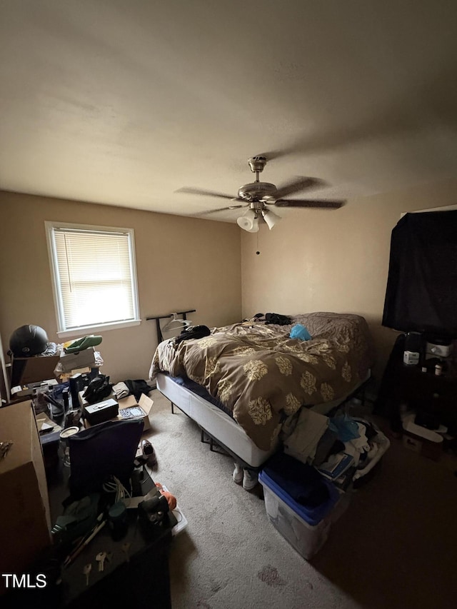 carpeted bedroom with a ceiling fan