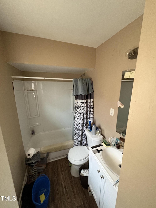 bathroom with toilet, shower / tub combo, wood finished floors, and vanity