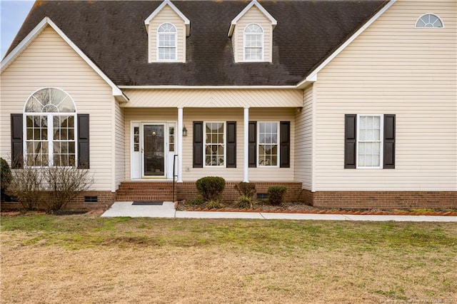 view of front facade with crawl space, a shingled roof, and a front lawn