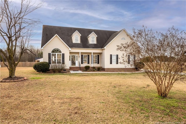 cape cod home with crawl space, fence, and a front lawn