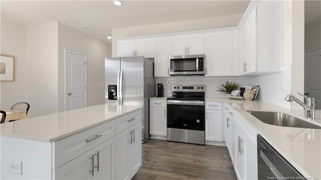 184 Hartfield Ave, Raeford, NC 28376 - kitchen with stainless steel appliances, a sink, recessed lighting, decorative backsplash, and light countertops