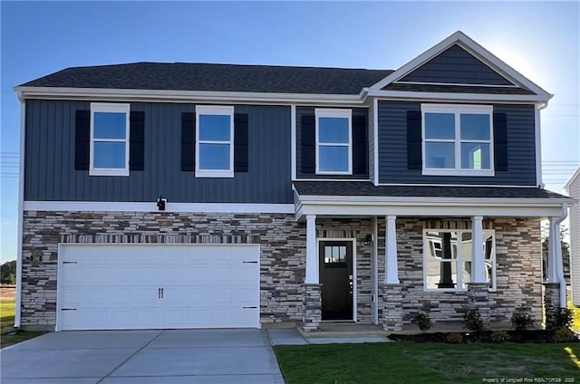 196 Hartfield Ave, Raeford, NC 28376 - craftsman house with stone siding, an attached garage, concrete driveway, a front yard, and covered porch