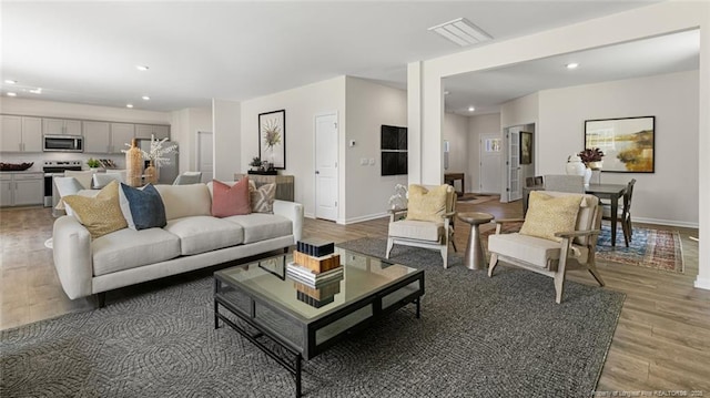 196 Hartfield Ave, Raeford, NC 28376 - living area with light wood-type flooring, recessed lighting, and baseboards
