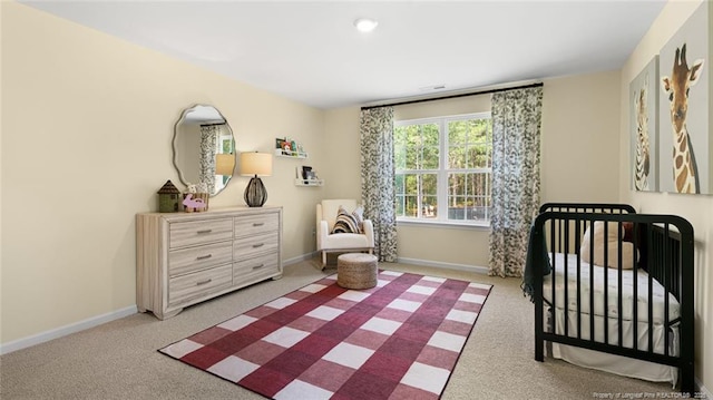 196 Hartfield Ave, Raeford, NC 28376 - carpeted bedroom featuring baseboards and a nursery area