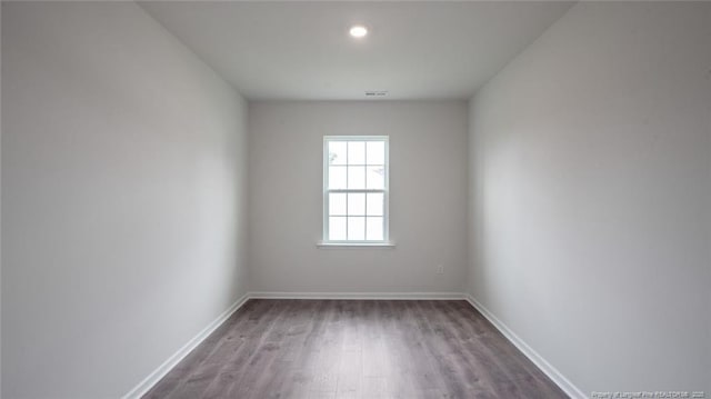 empty room featuring dark hardwood / wood-style floors